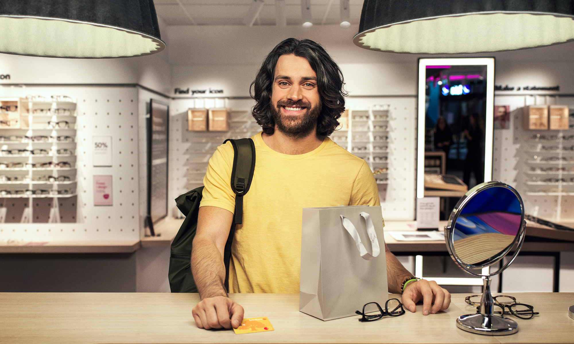 Man paying at the optician